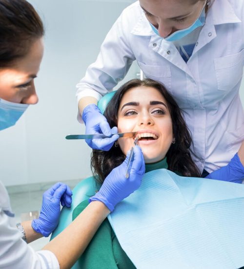 Dental doctors examining patient. Dentists are working.