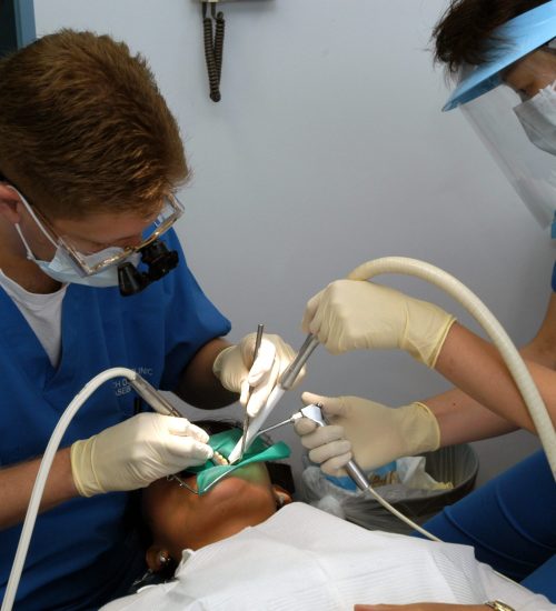 030620-N-8937A-002
U.S. Fleet Activities Sasebo, Japan  (Jun. 20, 2003) -- Lt. William Peterson (left) of Branch Dental Clinic Sasebo, Japan drills a cavity while his dental assistant, Miho Otubo, ensures the area remains clean.  U.S. Navy photo by PhotographerÕs Mate Airman Ian W. Anderson.  (RELEASED)